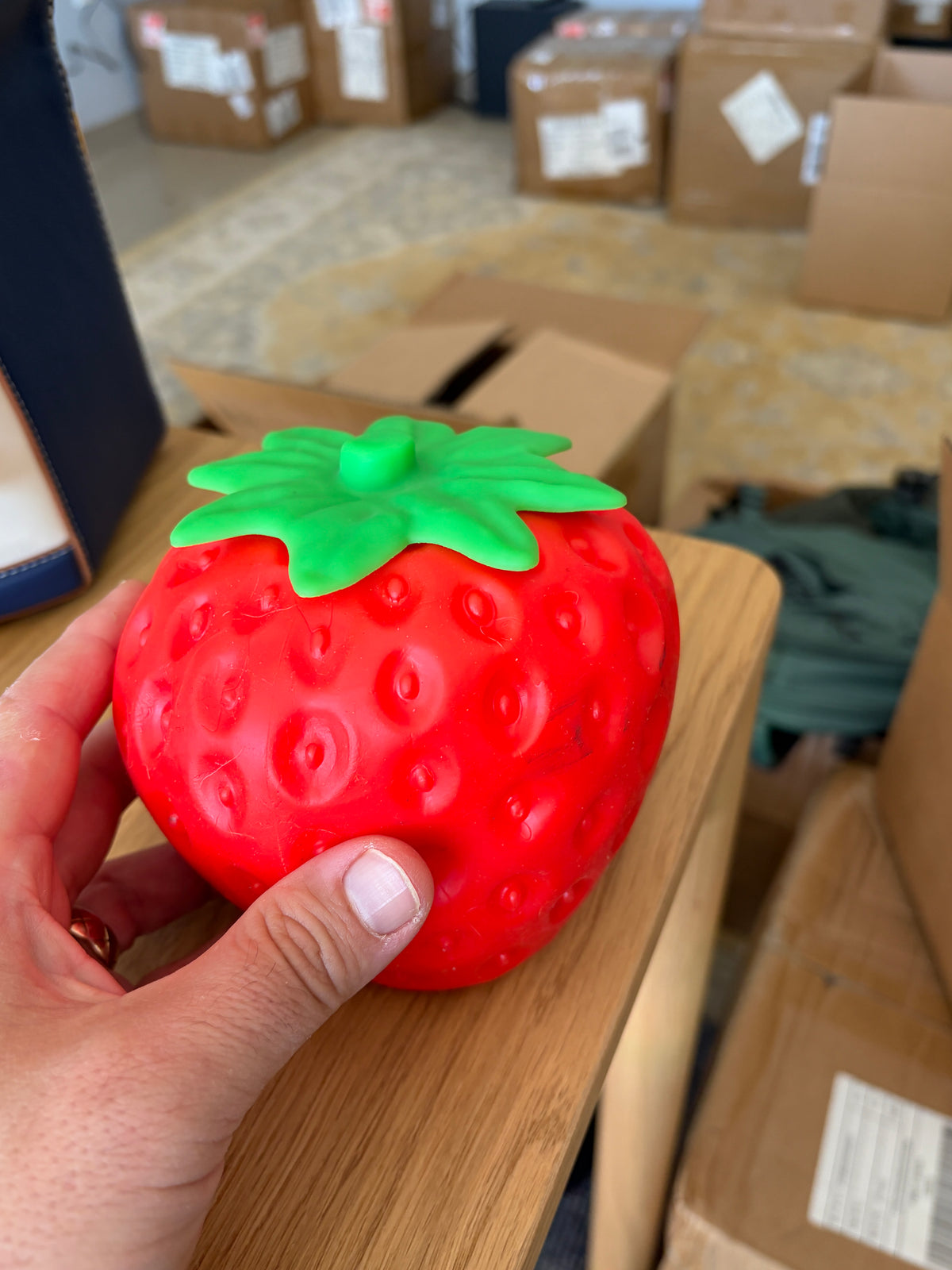 Large strawberry squishy shown in hand