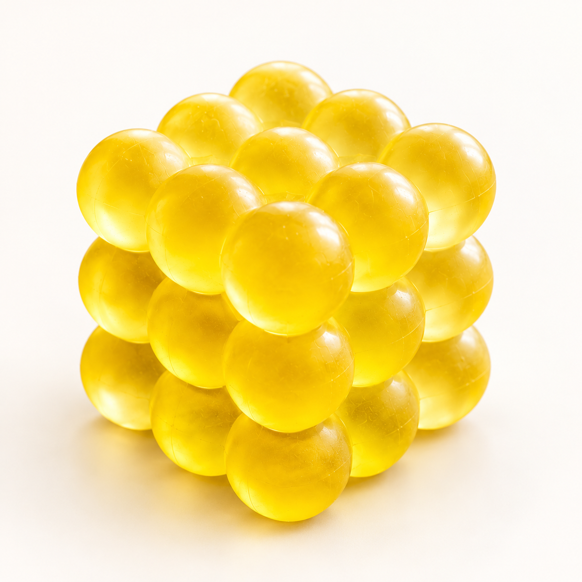 yellow Bubble Cube squishy — clean studio view