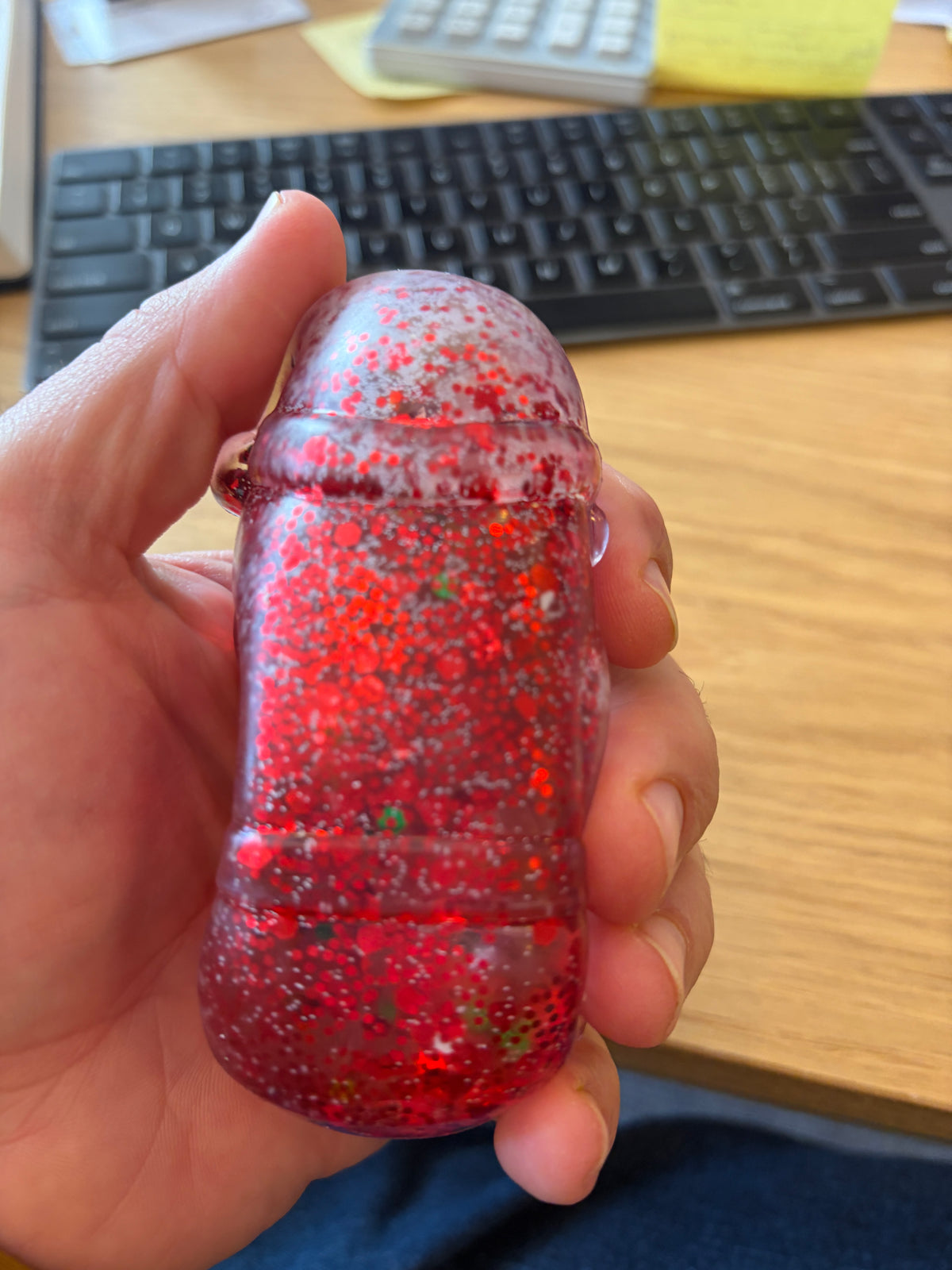 Actual rear view of the Feelzies Santa Claus Christmas Squishy, showing clear SlowFlow body and holiday glitter